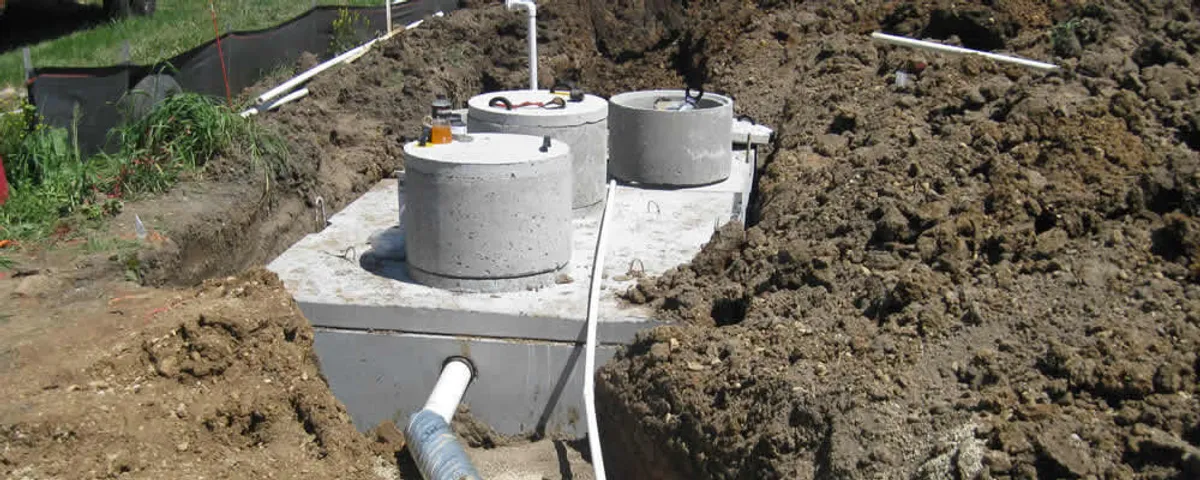 Septic system repair and installation site with tank access ports in Dayton, OH